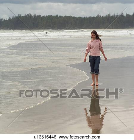 Teenage girl walking on beach, Pacific Rim Park, Vancouver Island, Canada View Large Photo Image Stock Photograph - Teenage girl walking on beach, Pacific Rim Park, Vancouver Island, Canada. Fotosearch