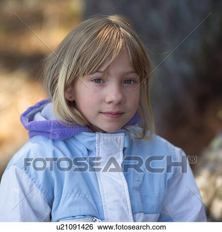 Young girl looking at camera smiling View Large Photo Image Stock Photograph - Young girl looking at camera smiling. Fotosearch