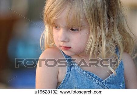 Young girl looking down View Large Photo Image Stock Image - Young girl looking down. Fotosearch