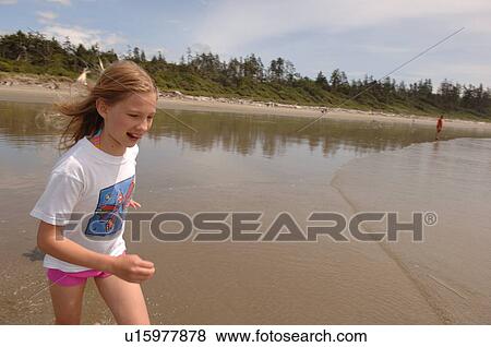 Young girl on beach, Pacific Rim National Park, Vancouver Island, Canada View Large Photo Image Stock Photo - Young girl on beach, Pacific Rim National Park, Vancouver Island, Canada. Fotosearch