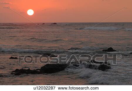 Stock Photo - Big Island of Hawaii - sunset from beach. Fotosearch