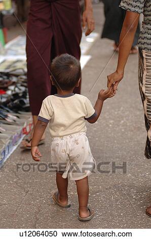 Back view of toddler holding hands View Large Photo Image Stock Image - Back view of toddler holding hands. Fotosearch
