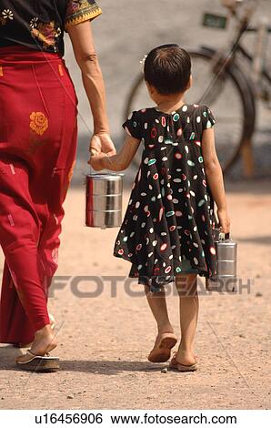 Burmese toddler carrying pail View Large Photo Image Stock Photograph - Burmese toddler carrying pail. Fotosearch