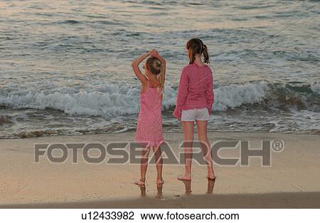 Kids playing on beach View Large Photo Image Stock Image - Kids playing on beach. Fotosearch