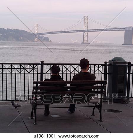 People seated at bench overlooking Golden Gate Bridge View Large Photo Image Stock Image - People seated at bench overlooking Golden Gate Bridge. Fotosearch