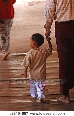 Toddler walking along dock View Large Photo Image Stock Photo - Toddler walking along dock. Fotosearch