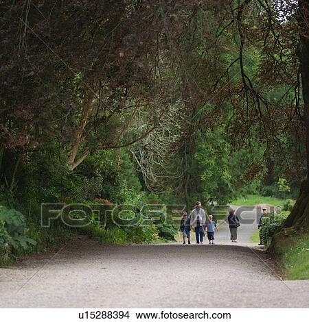 Picture - Family Walking Along Trail. Fotosearch