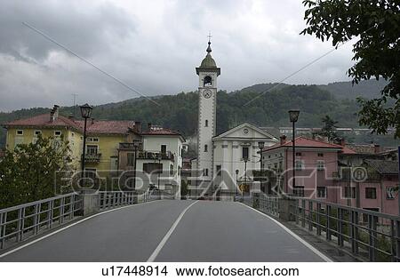 Picture - Road leading to a town in Slovenia. Fotosearch