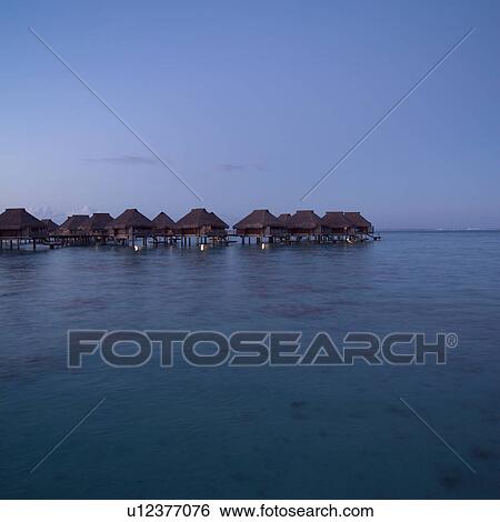 Bungalows over Ocean at Moorea in Tahiti View Large Photo Image Stock Photograph - Bungalows over Ocean at Moorea in Tahiti. Fotosearch
