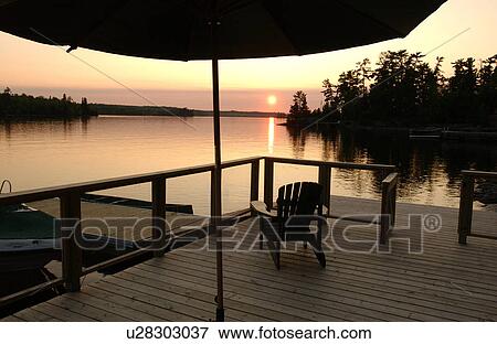 Stock Photo - Sunset views from dock. Fotosearch