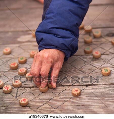 Man playing Chinese checkers View Large Photo Image Stock Photograph - Man playing Chinese checkers. Fotosearch