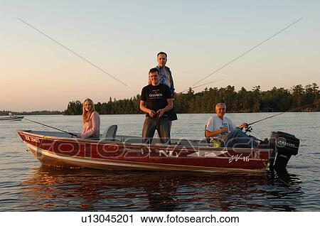 Stock Image - People in a boat fishing. Fotosearch