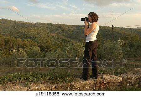 Woman Photographing Landscape View Large Photo Image Stock Photo - Woman Photographing Landscape. Fotosearch