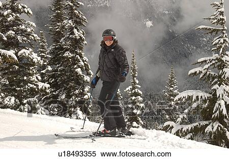 Stock Photography - Woman Skiing. Fotosearch
