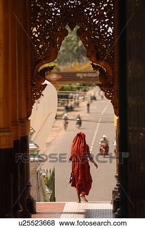 Burmese person walking out of pagoda View Large Photo Image Stock Photo - Burmese person walking out of pagoda. Fotosearch