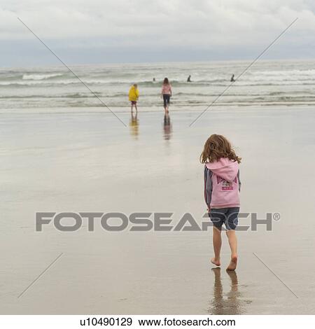 Stock Photo - Children on beach. Fotosearch