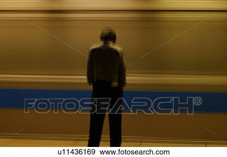 Stock Photo - Man Waiting at the Train Station. Fotosearch