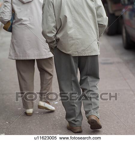 Stock Photography - People Walking on the Sidewalk. Fotosearch