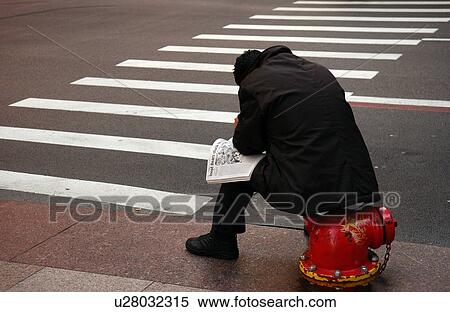 Rear view of a man sitting on a fire hydrant View Large Photo Image Stock Photography - Rear view of a man sitting on a fire hydrant. Fotosearch