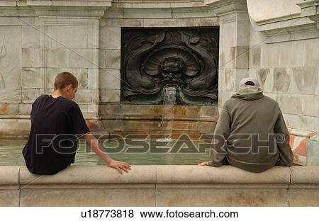 Tourists Sitting on Ledge of Fountain View Large Photo Image Stock Photo - Tourists Sitting on Ledge of Fountain. Fotosearch