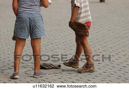 Stock Image - Two children standing on the street. Fotosearch
