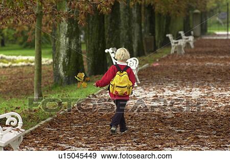 Stock Photo - Young child walking in a park. Fotosearch