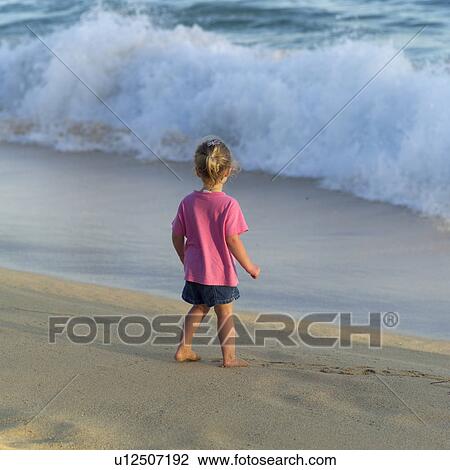Stock Image - Young Girl at the Beach. Fotosearch