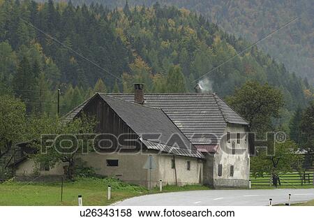 Road passing by a country home in Slovenia View Large Photo Image Stock Photo - Road passing by a country home in Slovenia. Fotosearch