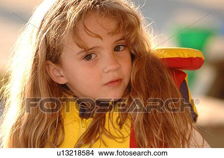 Picture - Close up of blond girl’s face. Fotosearch