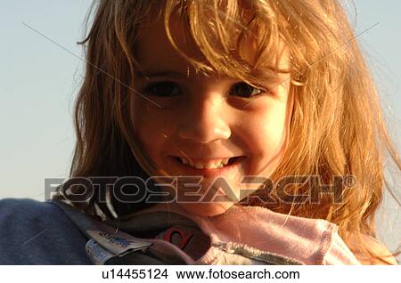 Picture - Close up of blond girl’s face. Fotosearch