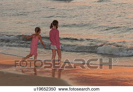 Kids playing on beach View Large Photo Image Stock Image - Kids playing on beach. Fotosearch