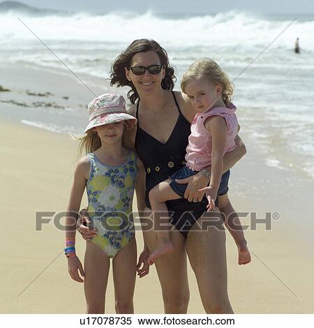 Stock Photography - Mother and Children at the Beach. Fotosearch