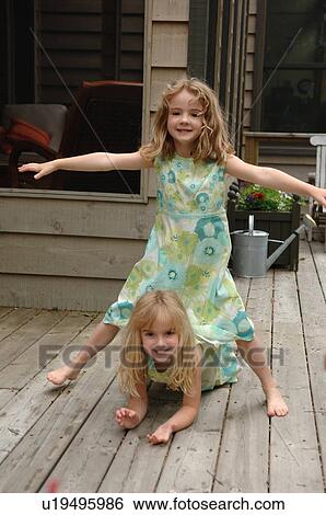 Stock Photograph - Two girls posing. Fotosearch