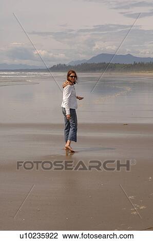 Young girl walking on beach, Pacific Rim National Park, Vancouver Island, Canada View Large Photo Image Stock Image - Young girl walking on beach, Pacific Rim National Park, Vancouver Island, Canada. Fotosearch