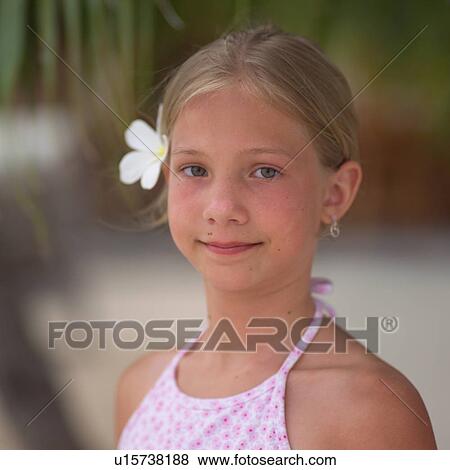 Young Girl with Flower in Her Hair View Large Photo Image Stock Photo - Young Girl with Flower in Her Hair. Fotosearch