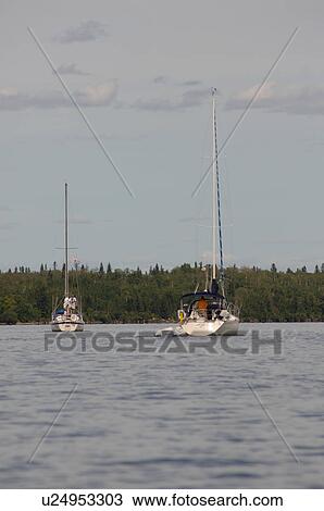 Stock Image - Sailboats on the lake. Fotosearch