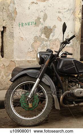 Stock Image - A motorcycle with a side car parked on a street. Fotosearch