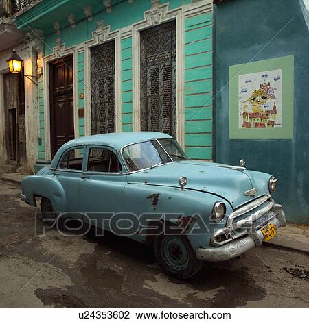 Antique car parked outside a building, Havana, Cuba View Large Photo Image Stock Image - Antique car parked outside a building, Havana, Cuba. Fotosearch