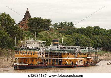 Stock Photography - Boat on the Irrawaddy River. Fotosearch
