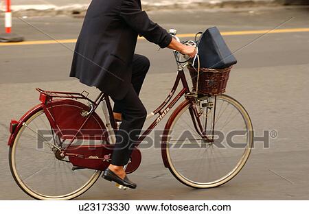 Stock Image - Businessman on Bike. Fotosearch