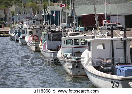 Fishing boats docked at a harbor in Prince Edward Island, Canada View Large Photo Image Stock Photography - Fishing boats docked at a harbor in Prince Edward Island, Canada. Fotosearch