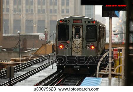 Train moving on the tracks at CTA Station in Chicago View Large Photo Image Stock Image - Train moving on the tracks at CTA Station in Chicago. Fotosearch