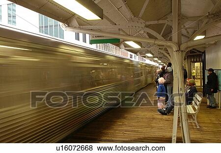 Train moving past a CTA station in Chicago View Large Photo Image Stock Photo - Train moving past a CTA station in Chicago. Fotosearch