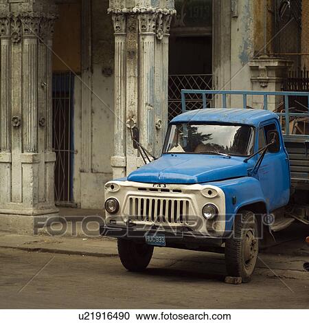 Stock Image - Truck parked outside a building, Havana, Cuba. Fotosearch