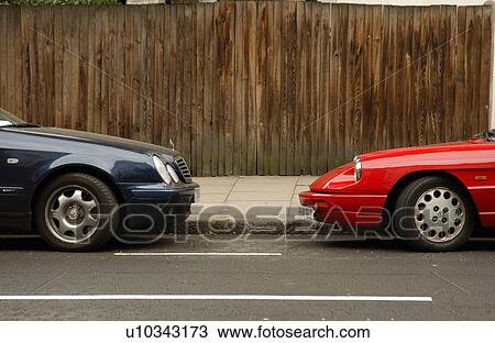 Stock Image - Two Cars Facing Eachother. Fotosearch