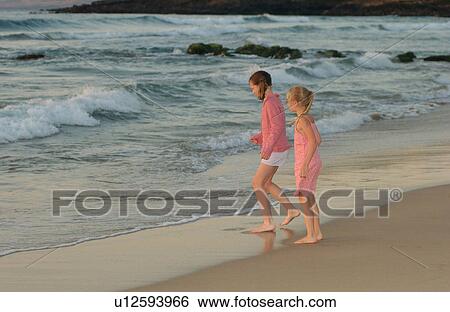 Stock Photograph - Kids playing on beach - Hawaii. Fotosearch