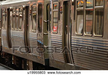 Stock Image - Train on the tracks at CTA Station in Chicago. Fotosearch