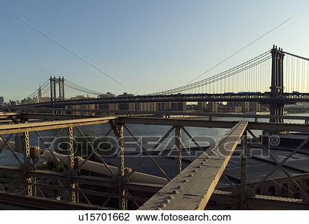 Stock Image - View of Manhattan Bridge from Brooklyn Bridge, New York City. Fotosearch