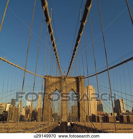 Stock Image - Walkway on Brooklyn Bridge, New York City. Fotosearch