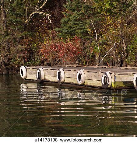 Stock Photo - Dock at edge of forest. Fotosearch